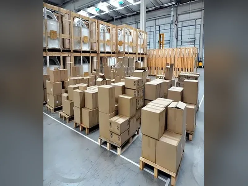 Cartons of bearings staged on pallets for pickup