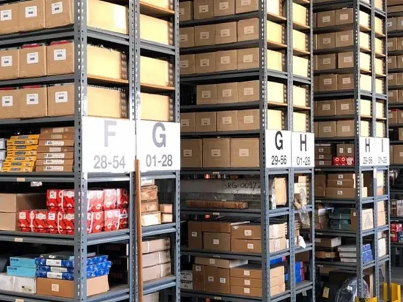Rows of boxed bearing stock in a warehouse aisle