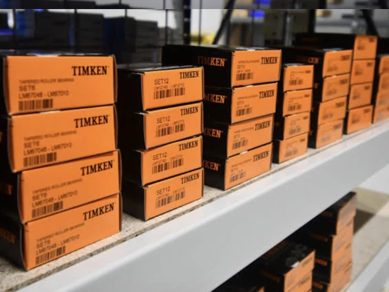 Rows of orange Timken bearing cartons on a warehouse shelf